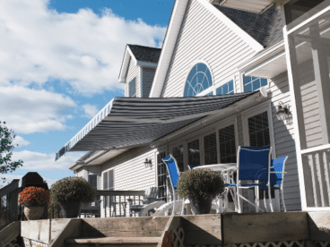 large house with a retractable SunPro awning