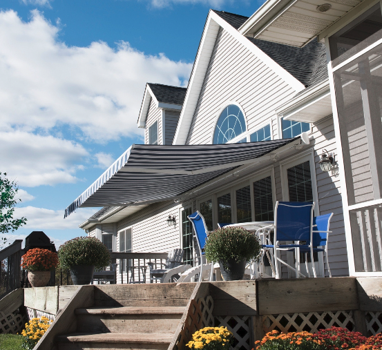 large house with a retractable SunPro awning