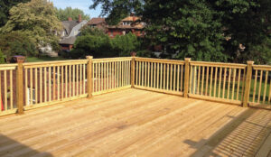 An all wood deck supplied by Ladiesburg Lumber, it is a natural wood color.