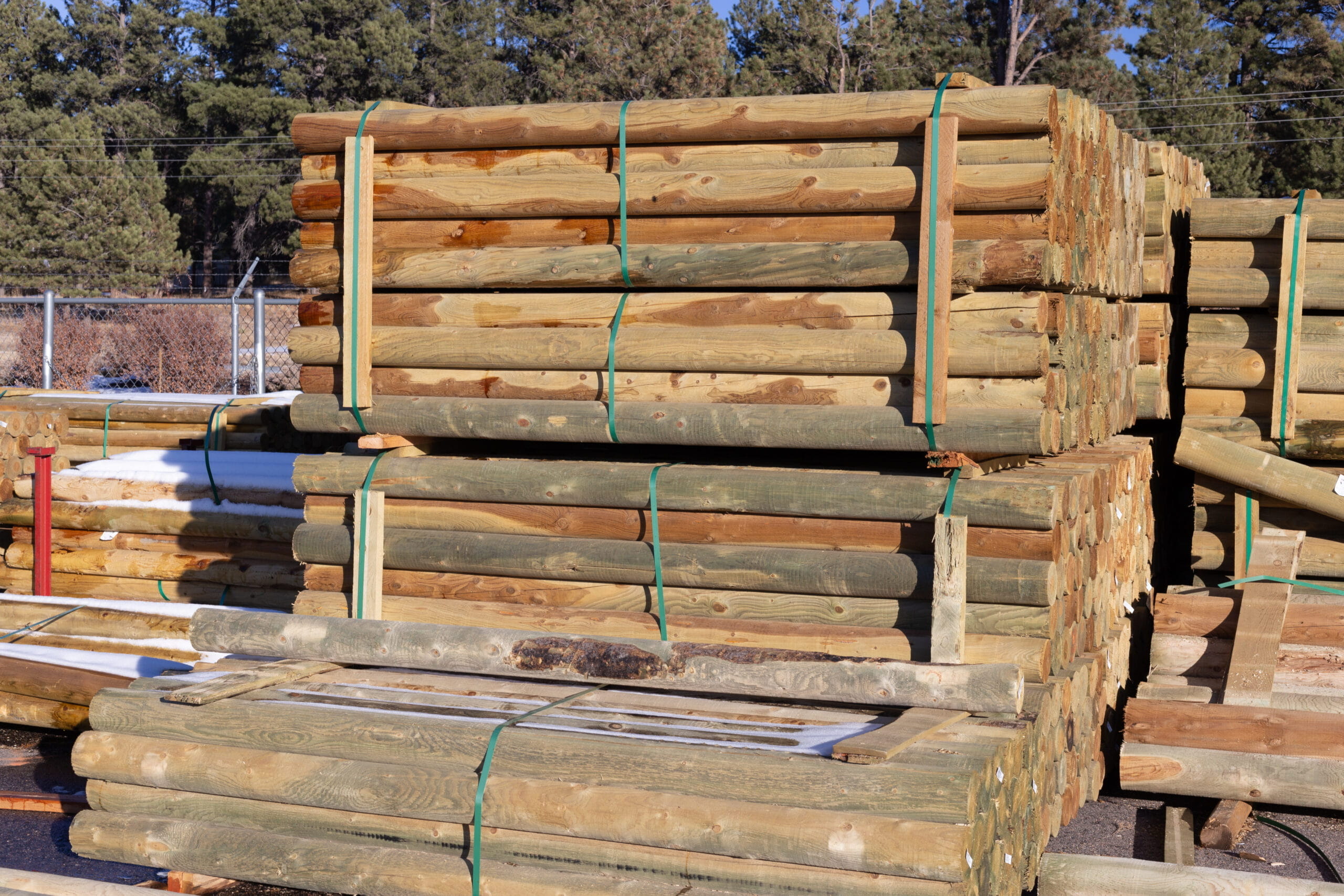 A large stack of lumber and unrefined logs at Ladiesburg Lumber.