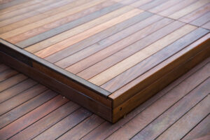 A close up shot of a dark brown deck step up.