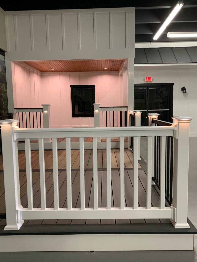 A staged deck inside the Ladiesburg Lumber showroom, featuring built in lights on each post.