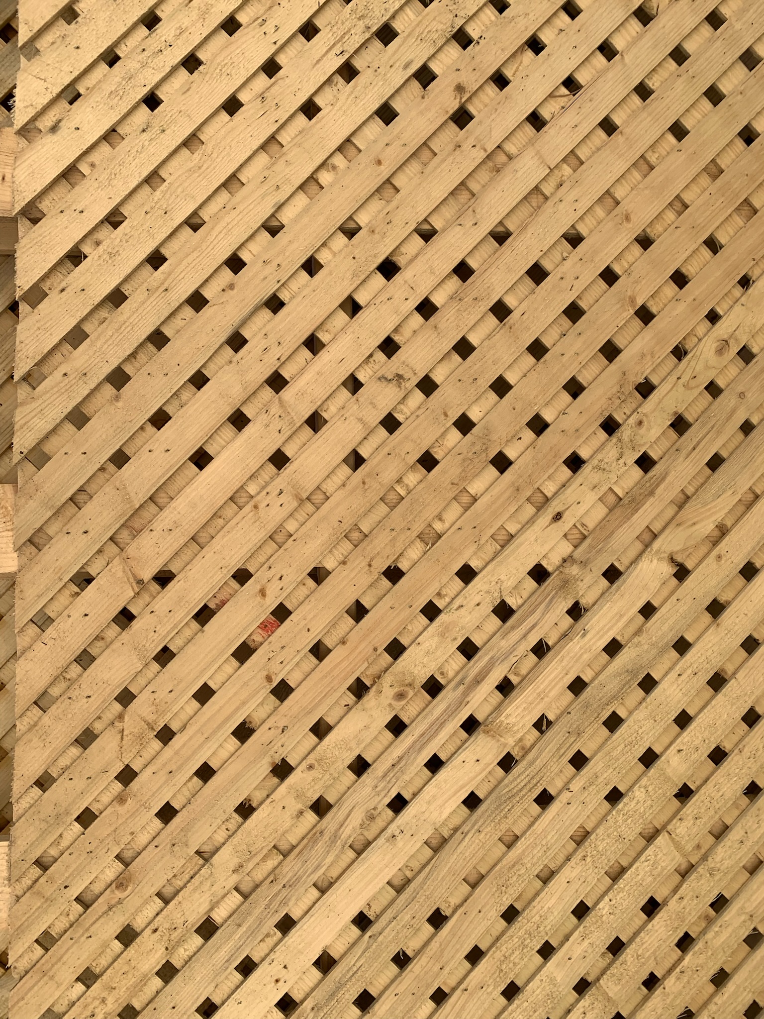 A wooden lattice privacy wall.