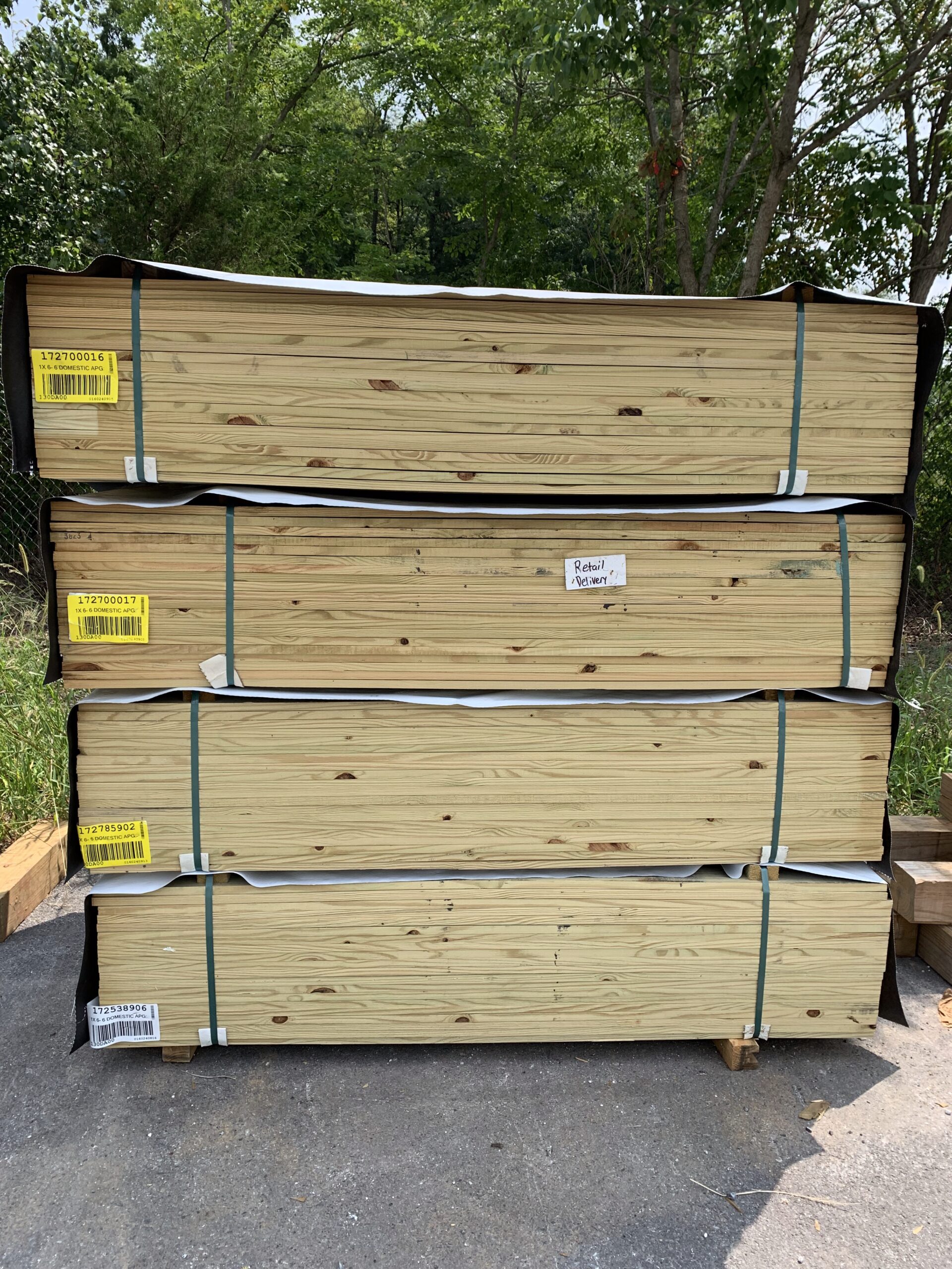 Four stacks of 1x6 lumber in the Ladiesburg Lumber parking lot.