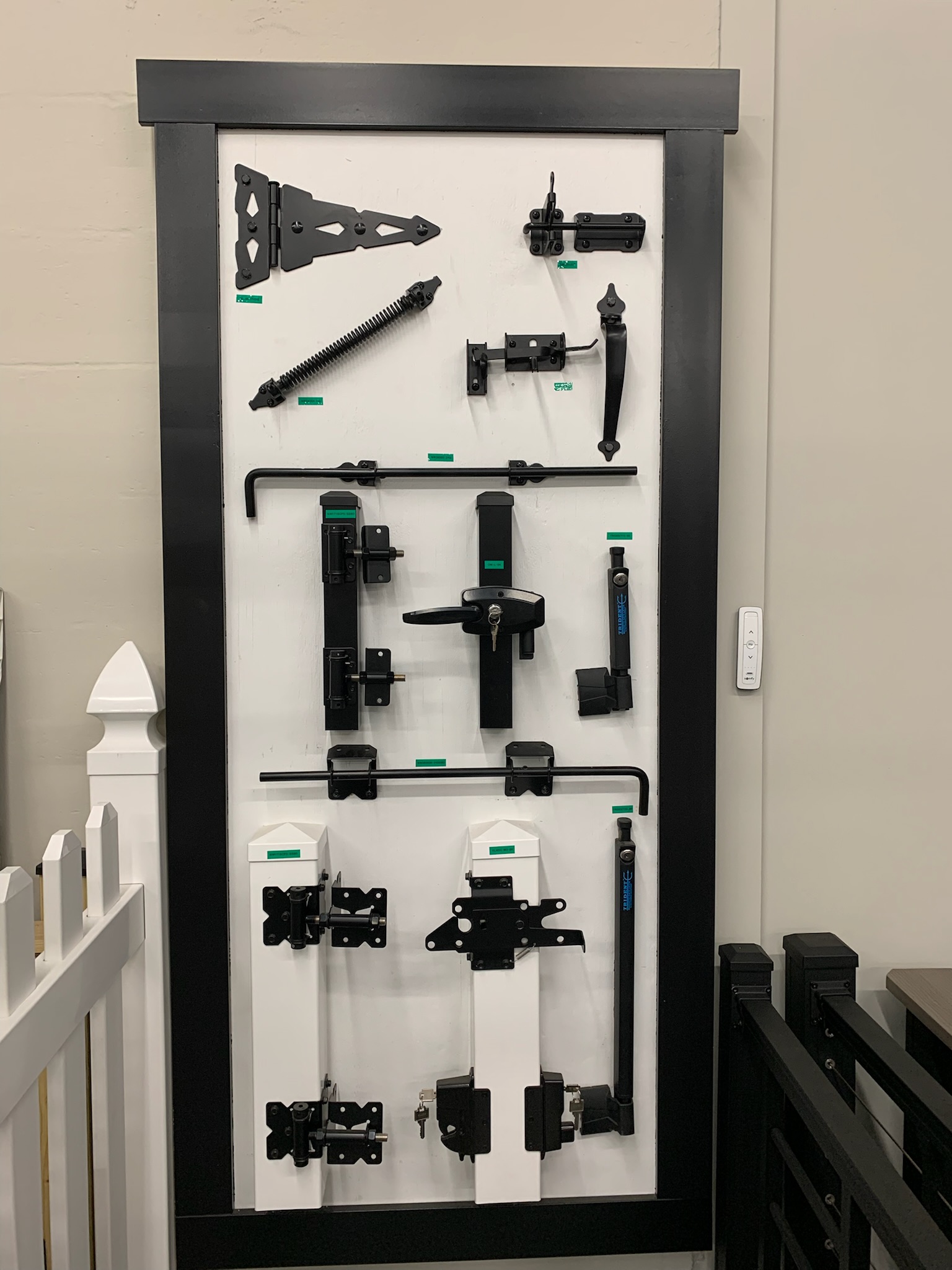Metal brackets and other fencing accessories on display inside Ladiesburg Lumber.