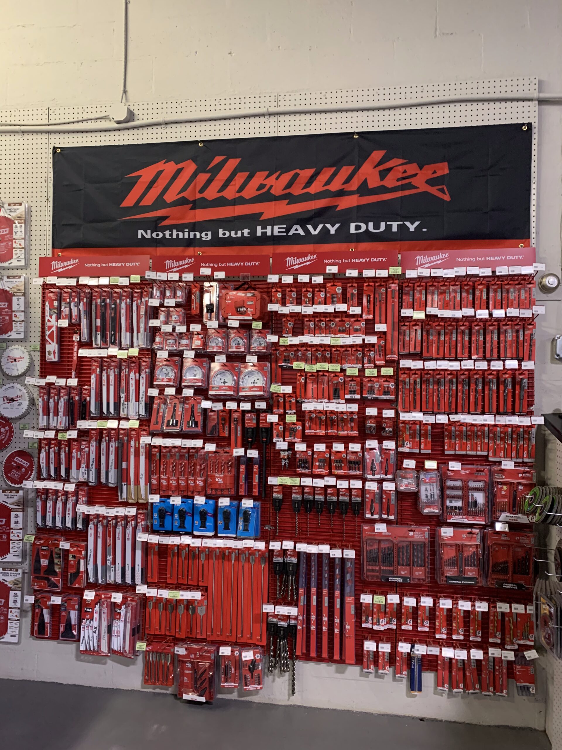A Milwaukee tool and accessory display inside the Ladiesburg Lumber store.