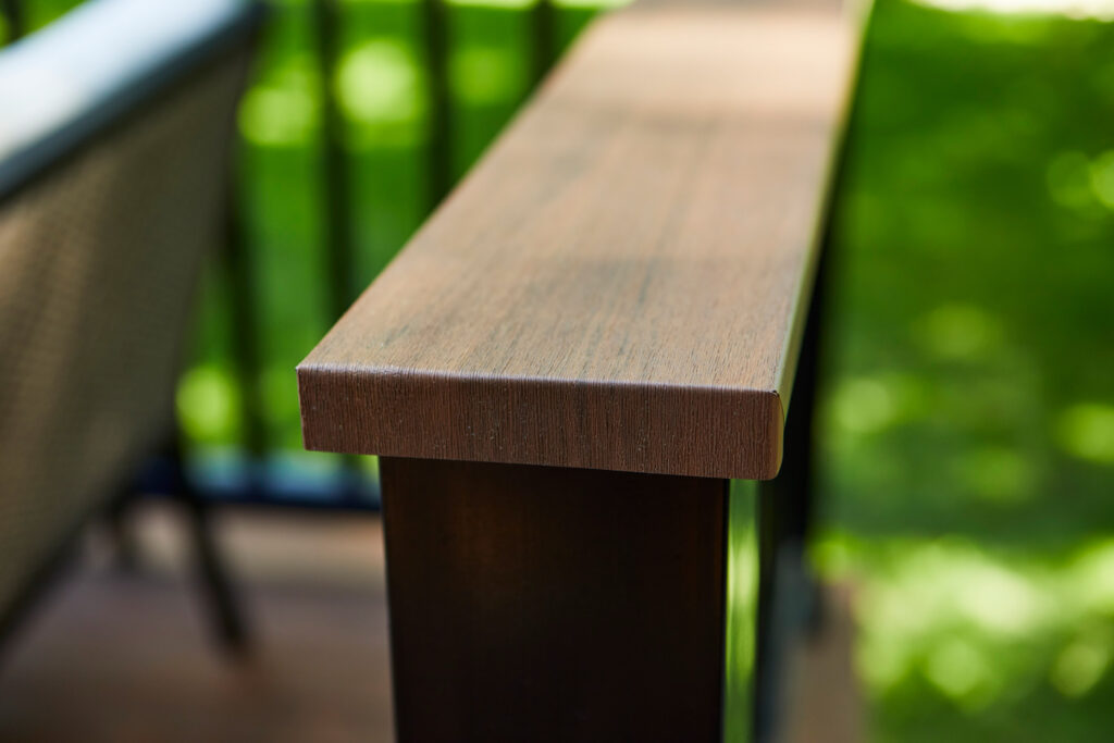 A close up shot of a wood deck railing.