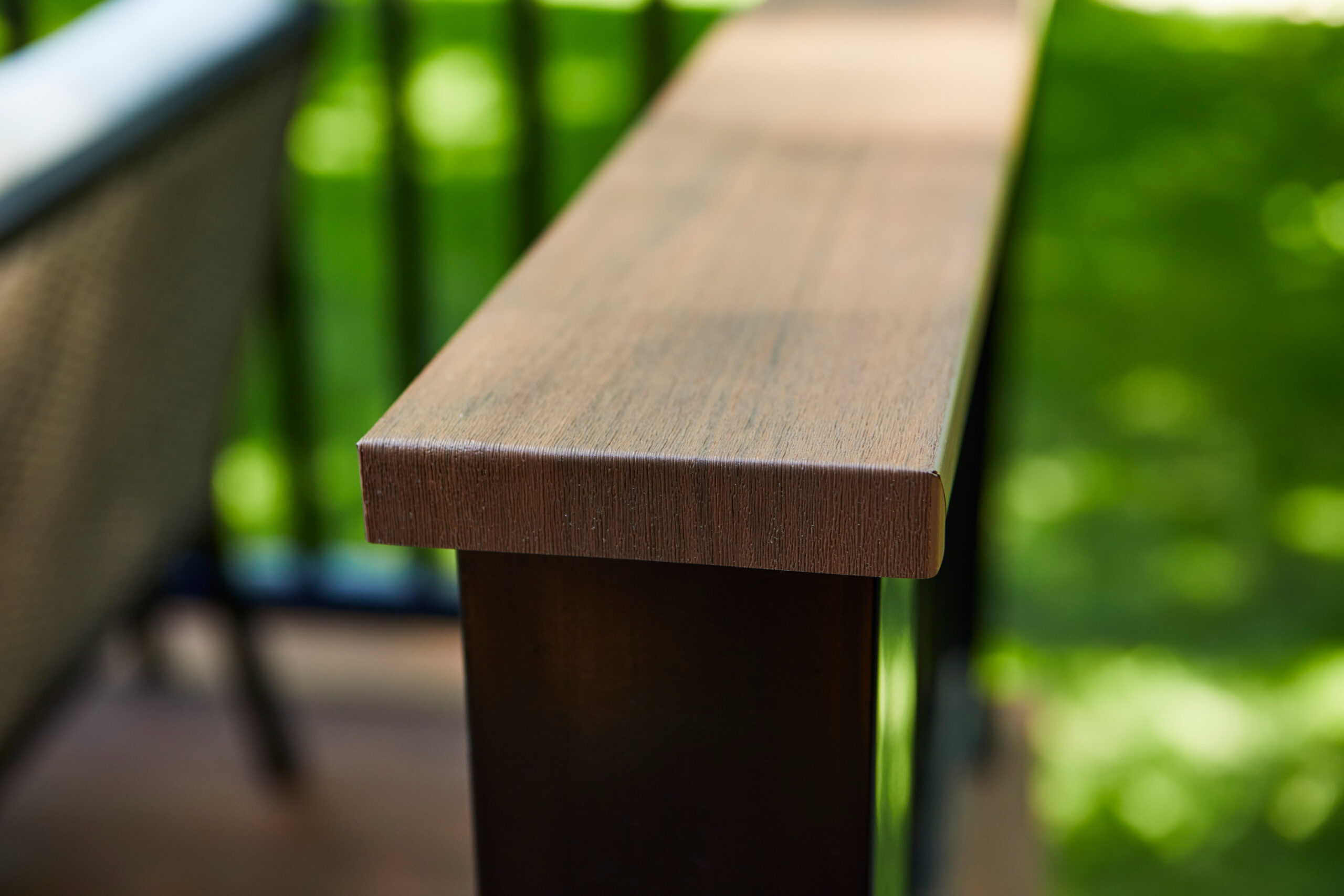 A close up shot of a wood deck railing.